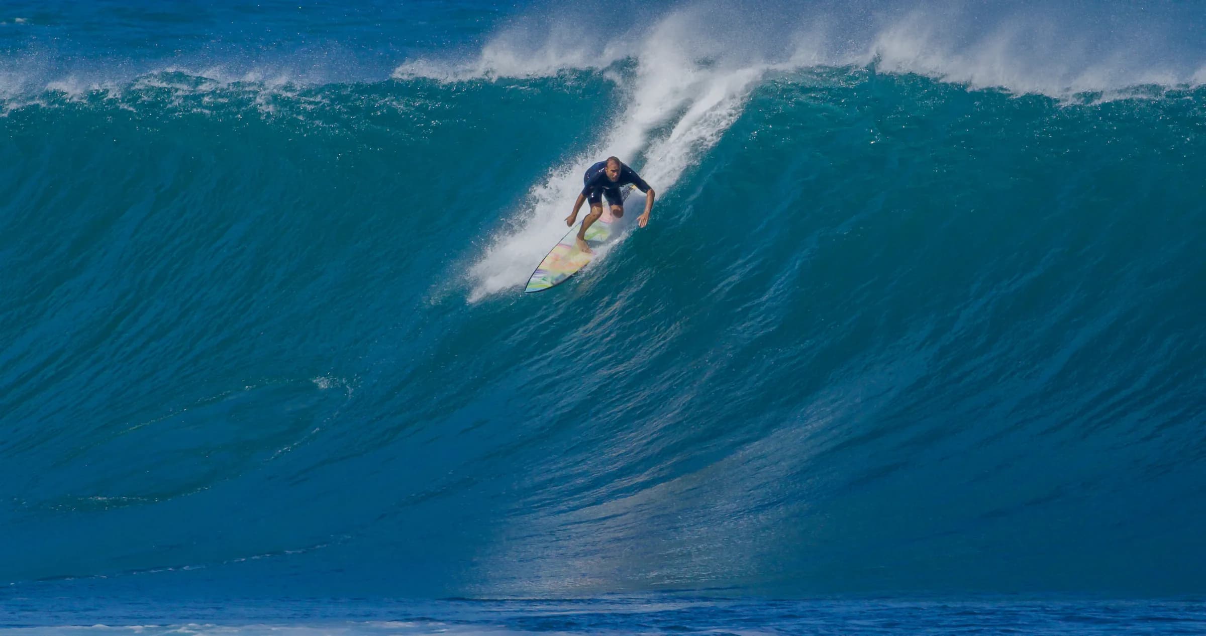 Surfer riding a big barrel wave at Pipeline on the North Shore of Oahu, Hawaii